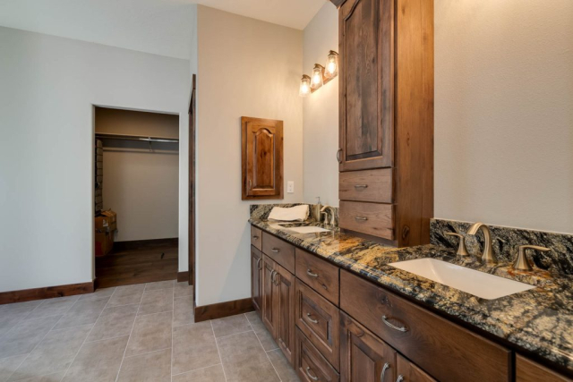 23Master bath-FULL double sinks with dark marble counter top in spacious bathroom