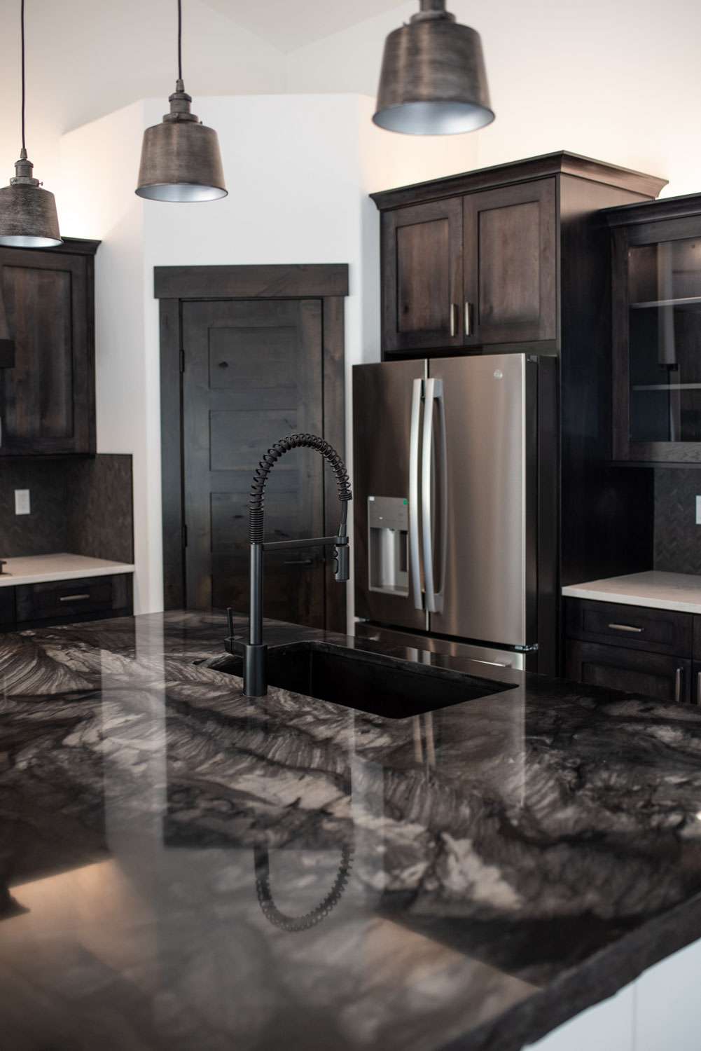 25299 N Werre Rd dark marble kitchen island design in a custom home